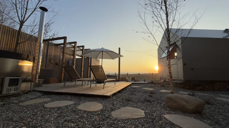 Sunset at the wellness area — silhouettes of lounger and sauna